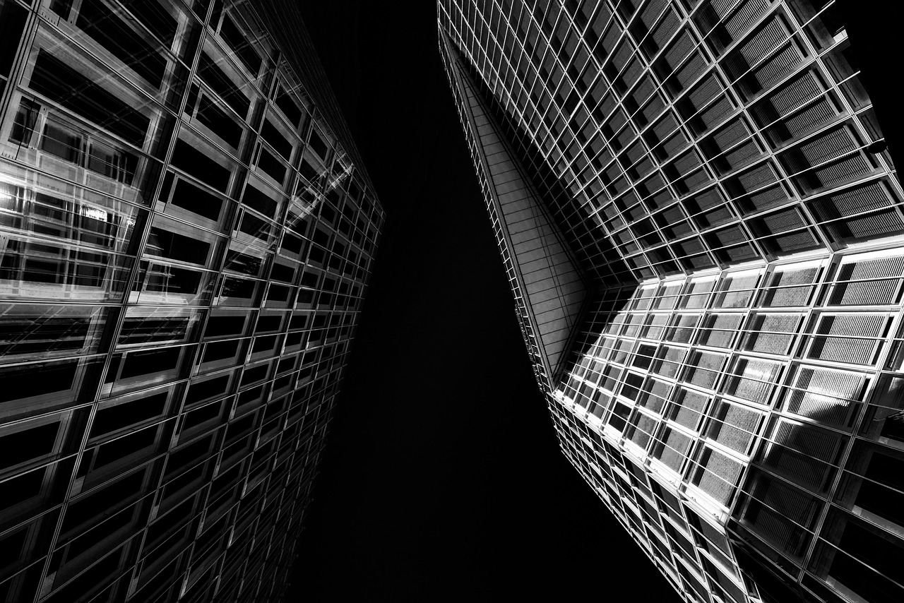 A modern glass banking tower reflecting sunlight, symbolizing the evolving financial landscape.