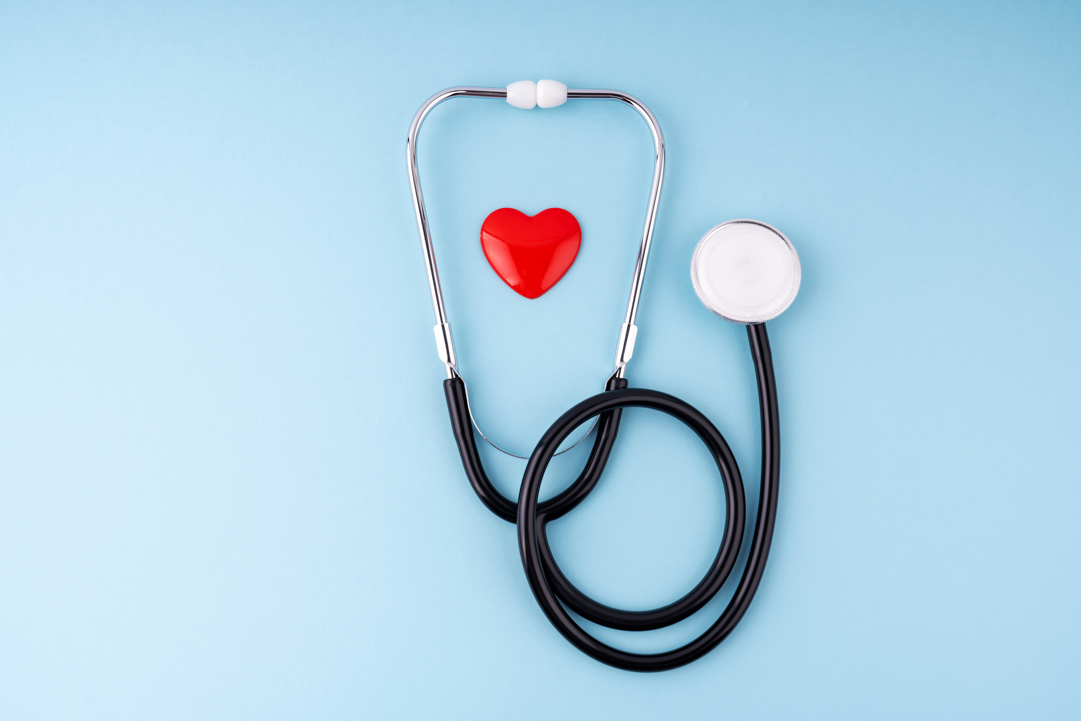 Stethoscope and heart symbol representing healthcare and insurance coverage.