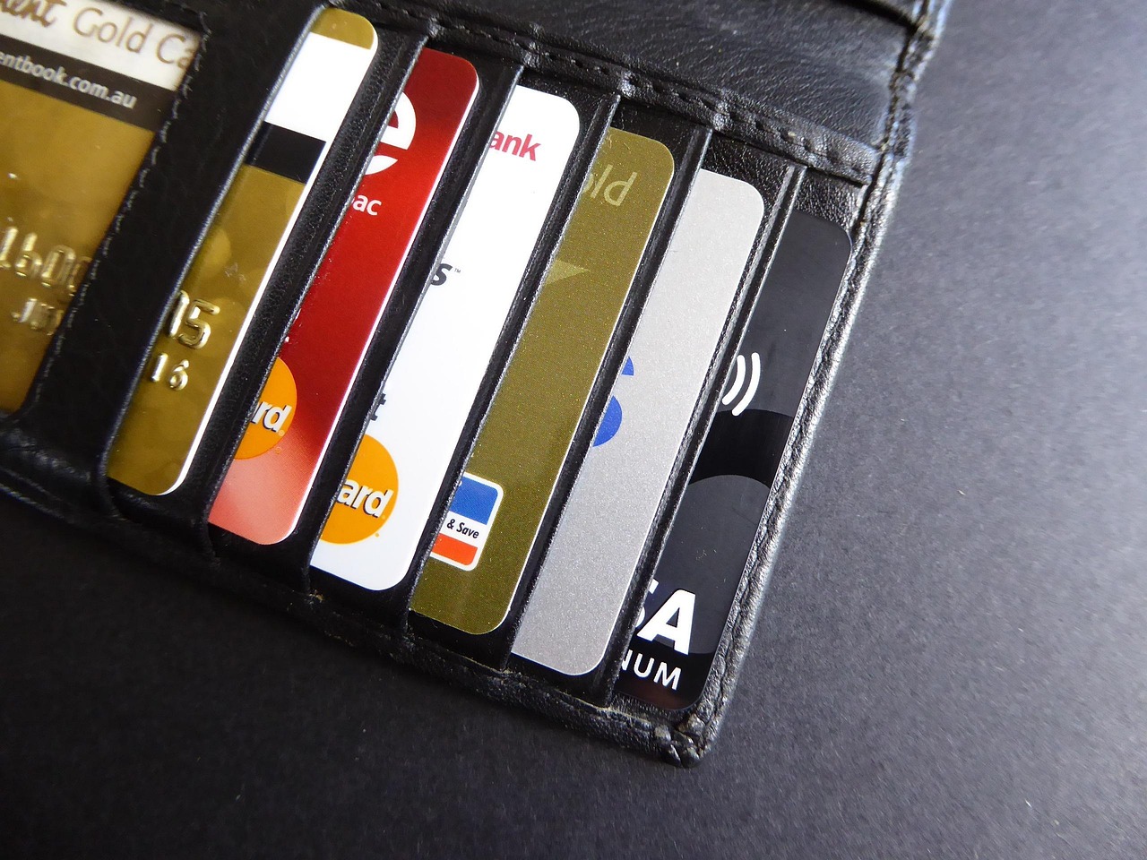 A high-quality leather wallet with multiple credit cards neatly arranged.