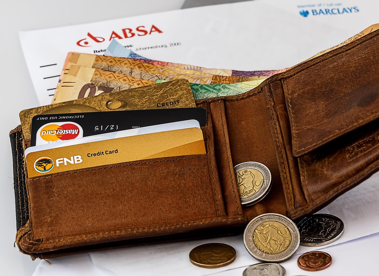 A leather wallet filled with multiple credit cards, symbolizing a diverse rewards portfolio.