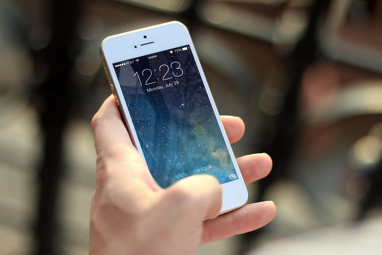 A person using a smartphone for secure banking authentication with a focus on the screen.