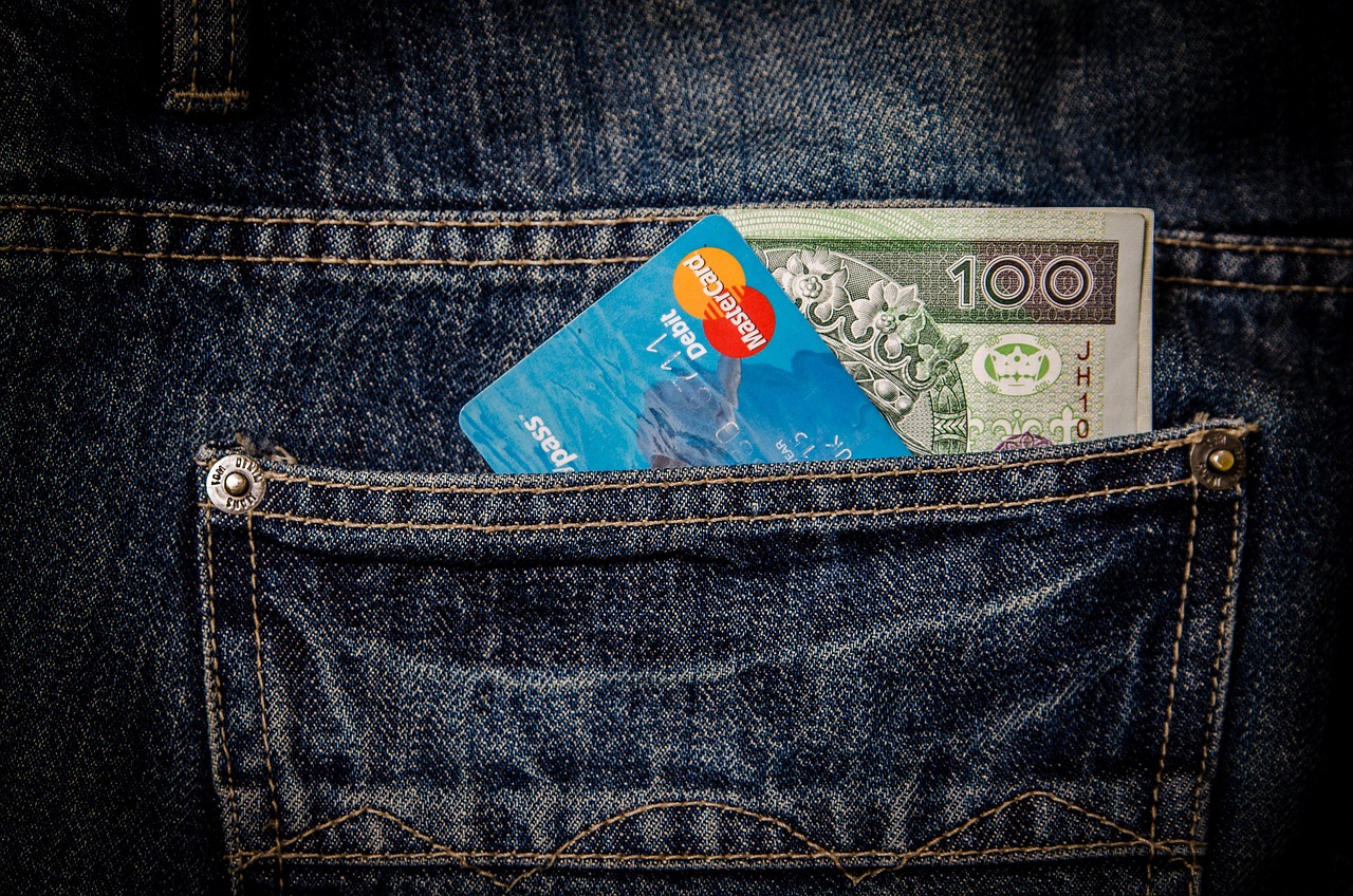 A concept photo of a padlock and chain around financial symbols to represent asset illiquidity.