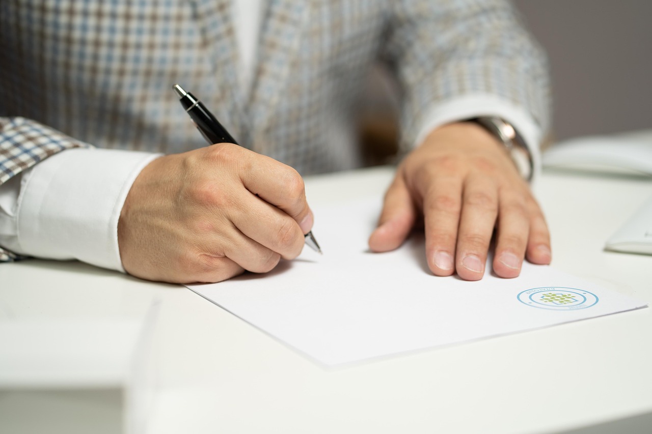 A husband and wife reviewing car registration papers together