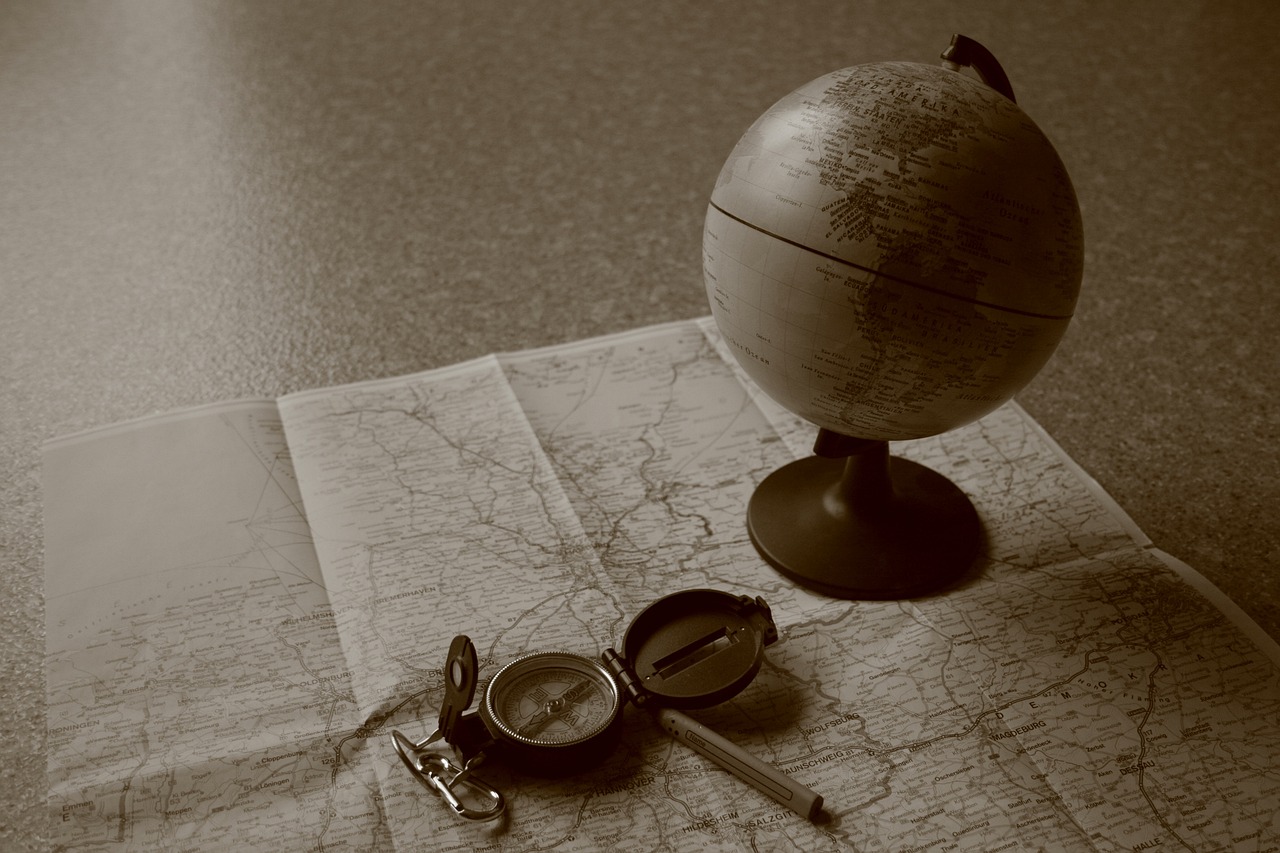 A compass and a map representing a change in direction or financial strategy