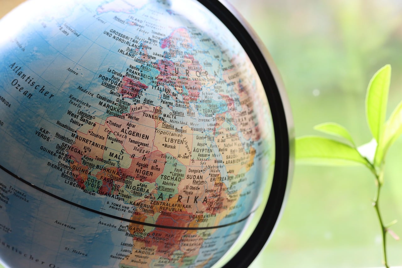 A glowing digital world map illustrating international market connectivity.