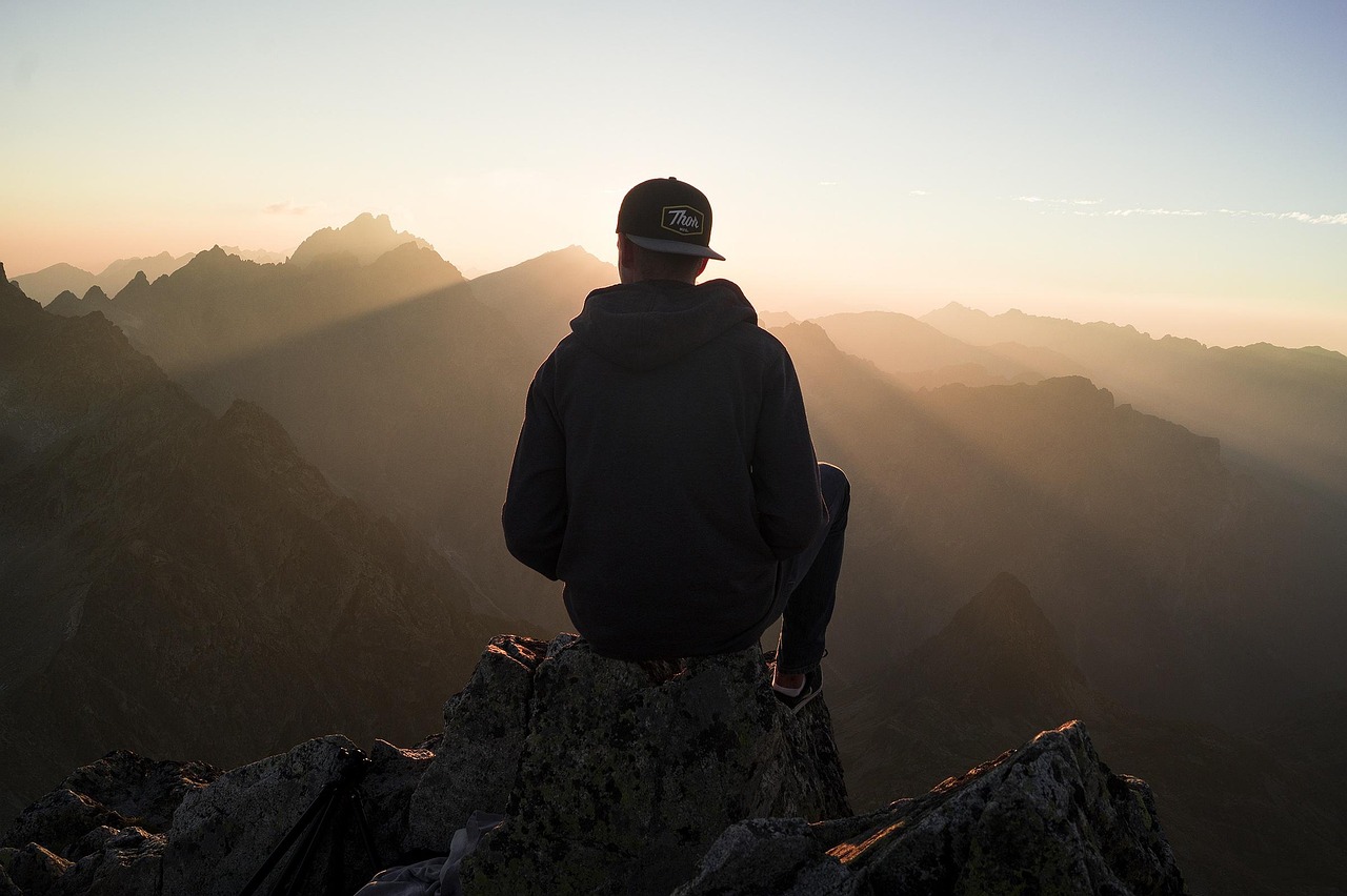 A person looking out over a calm landscape symbolizing long-term investment vision.