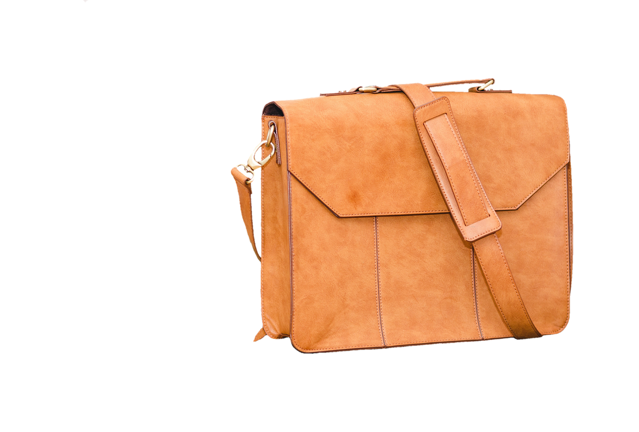 High-end designer leather luggage set on a marble floor.