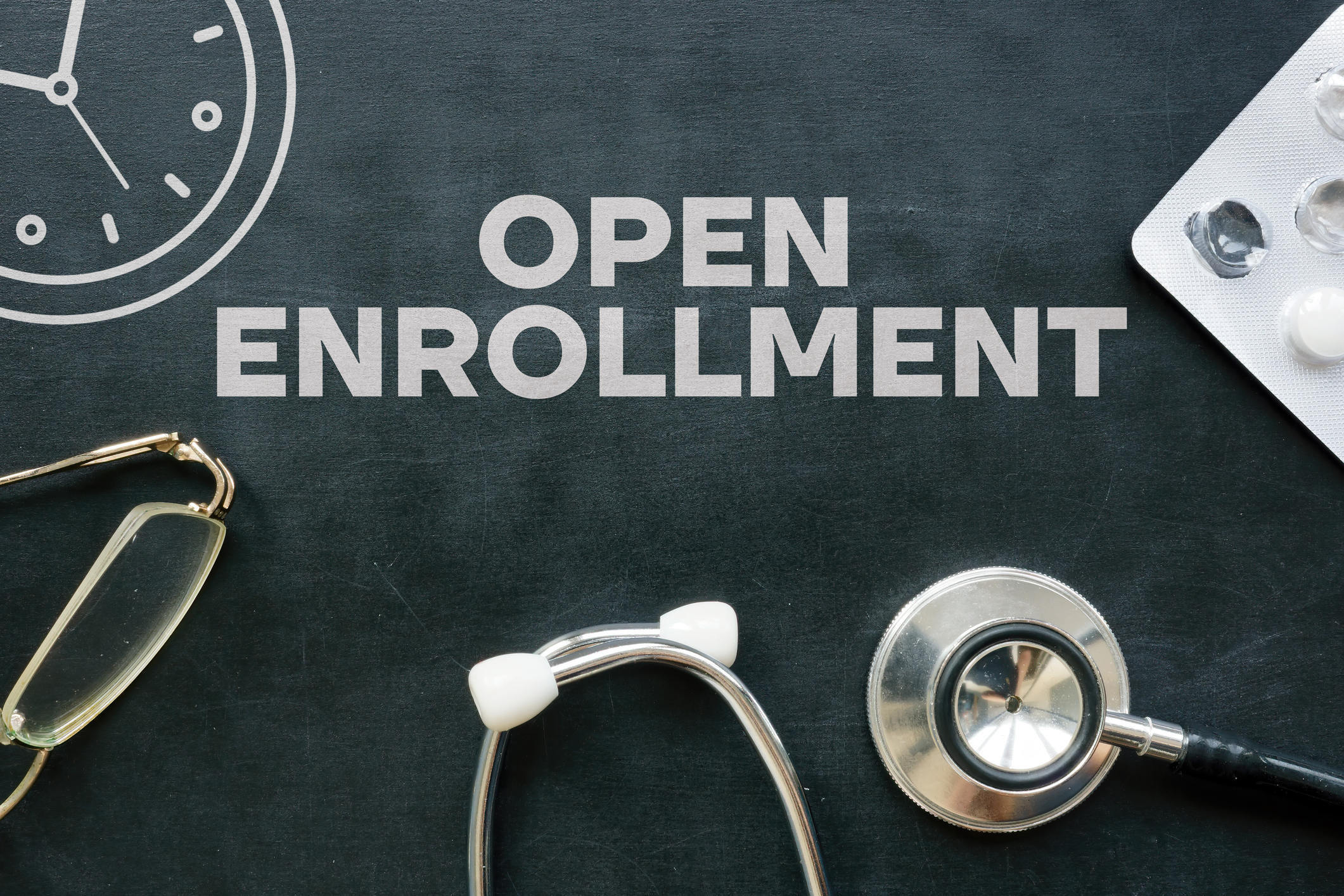Bold, clear text stating 'Open Enrollment' representing the seasonal window for Medicare plan changes.