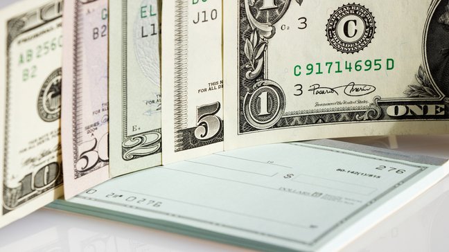 Illustration of a local check-cashing storefront often associated with high transaction fees.