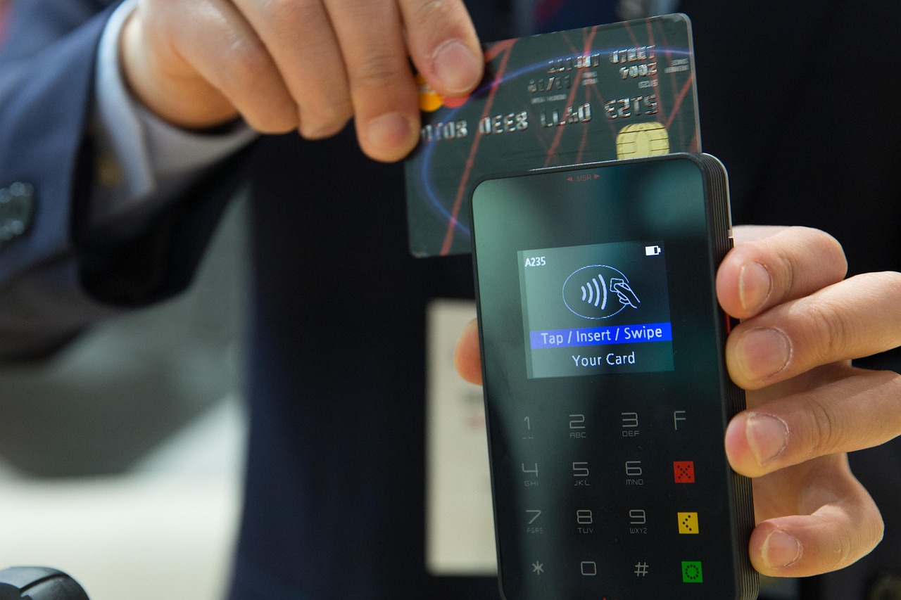 A smartphone tapping a payment terminal for a secure digital transaction.