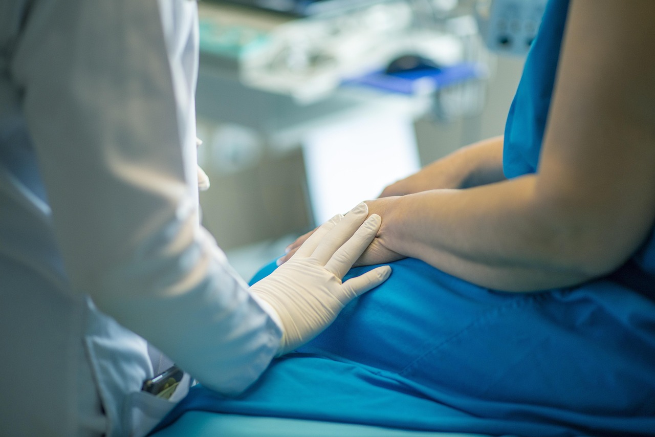 A doctor explaining medical results to a patient in a clinical setting.