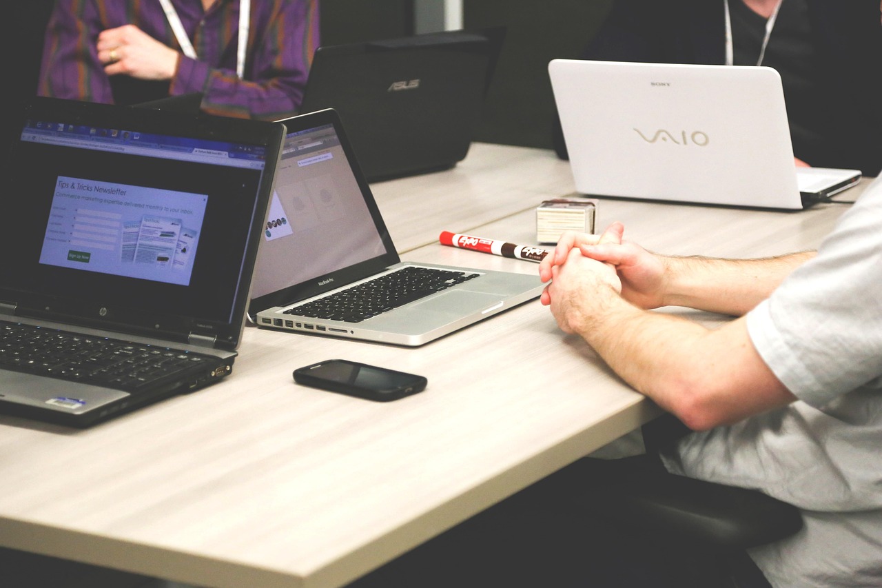 A clean, modern workspace with a laptop and coffee, representing the remote founder lifestyle.