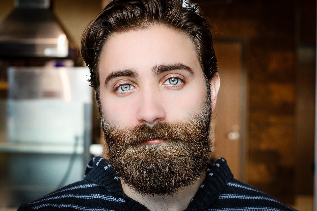 A person looking thoughtful and dressed in simple, conservative professional attire.