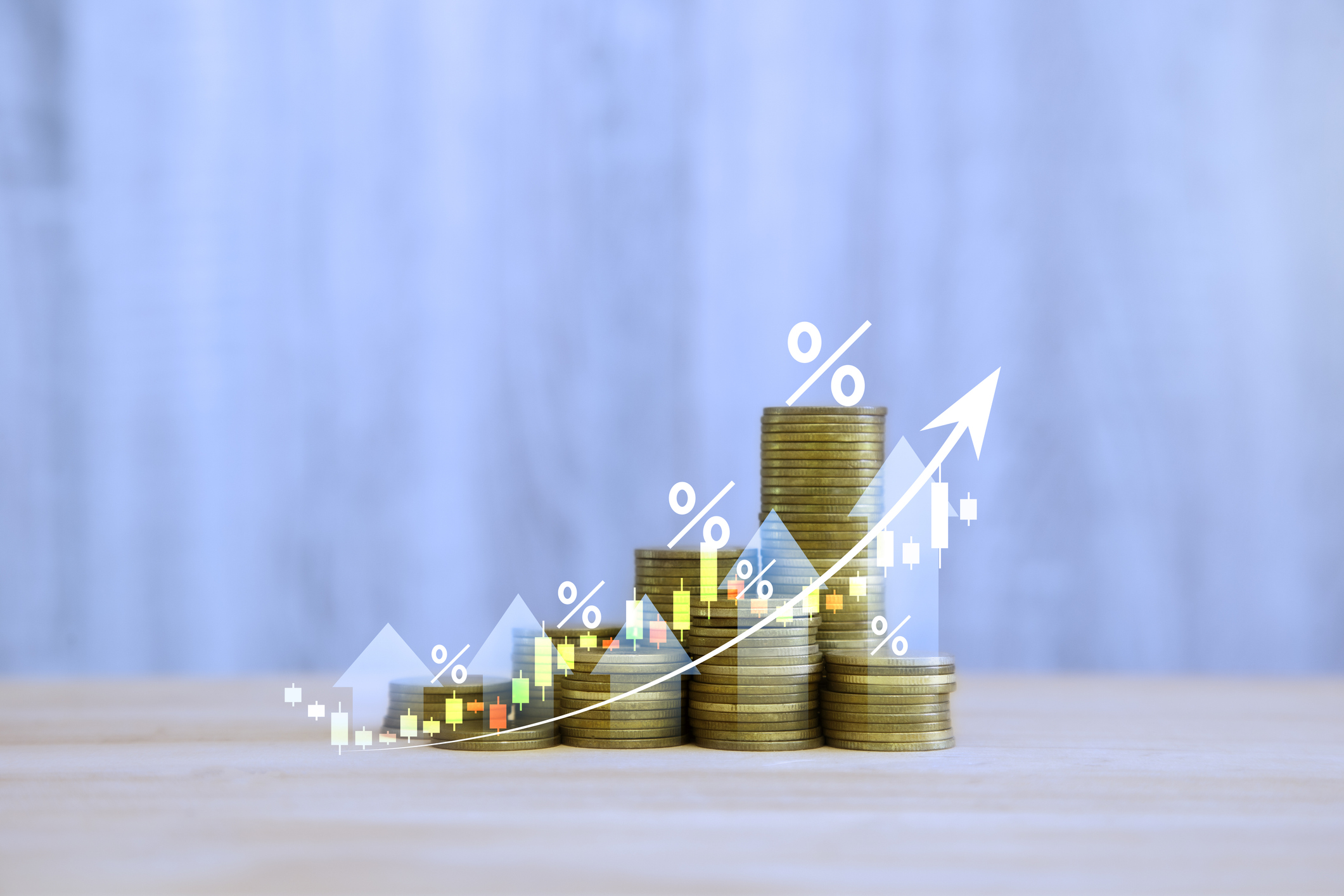 Rising coin stacks with upward arrows and percentage symbols indicating growth.