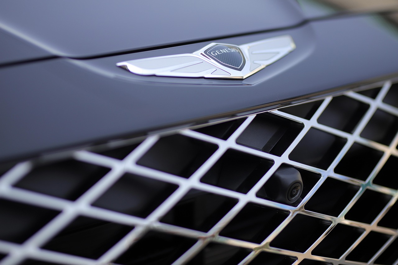 A close up of a modern car dashcam mounted on a windshield