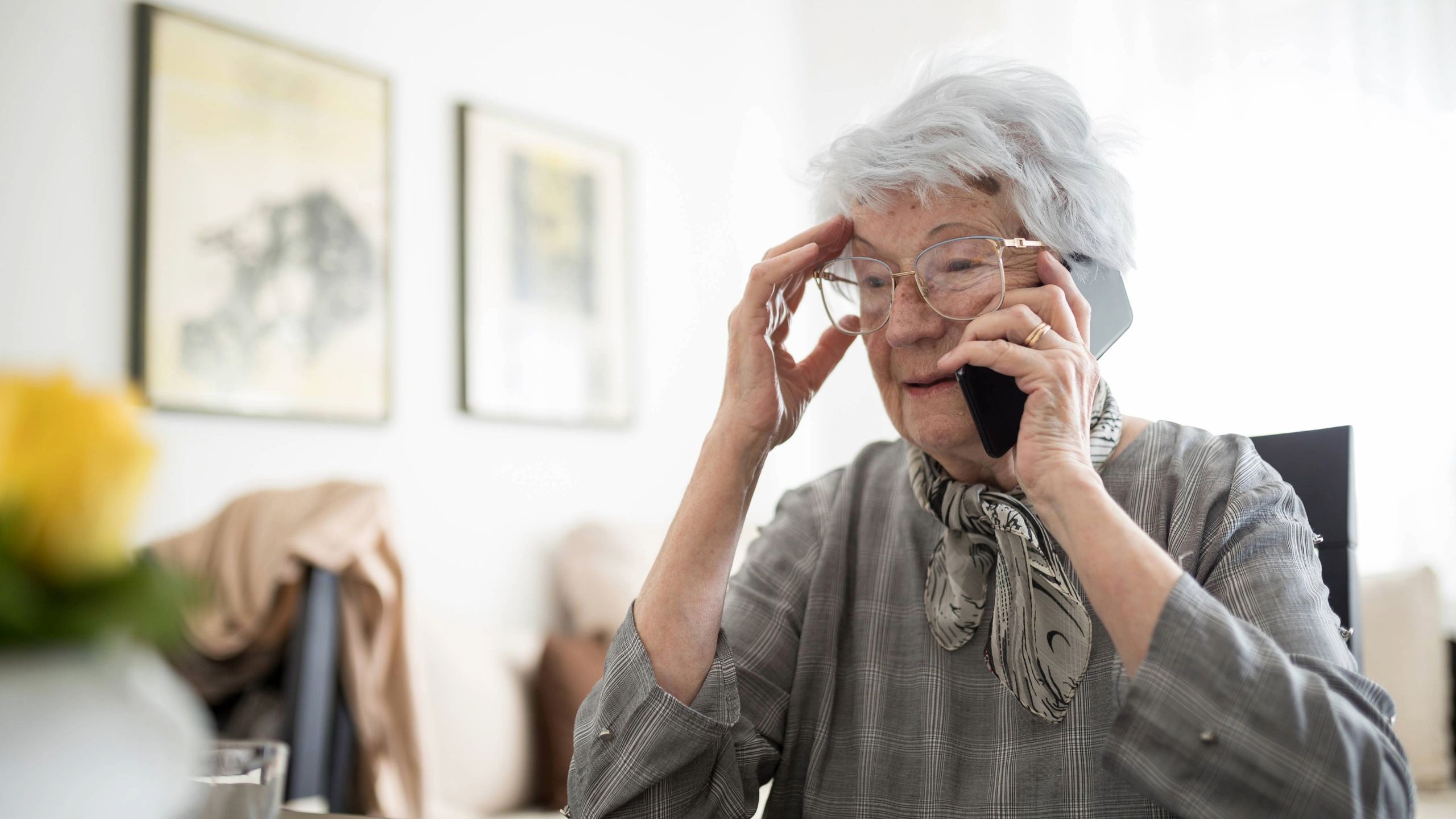 Text graphic asking if a voice call is a grandkid or an AI scam with tips to protect money.