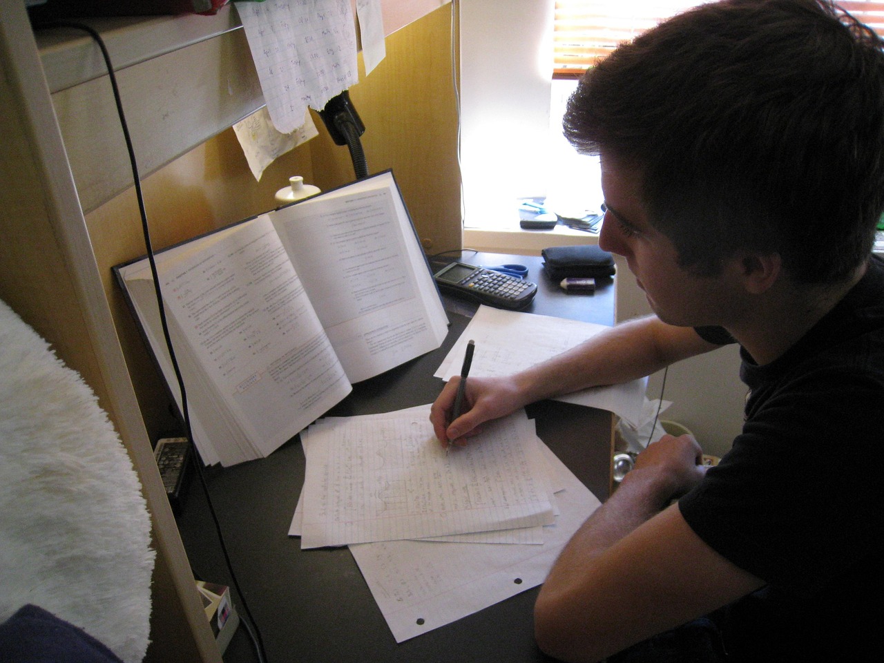 A professional looking at a laptop screen intently, symbolizing the resolve to escalate a rejected dispute.