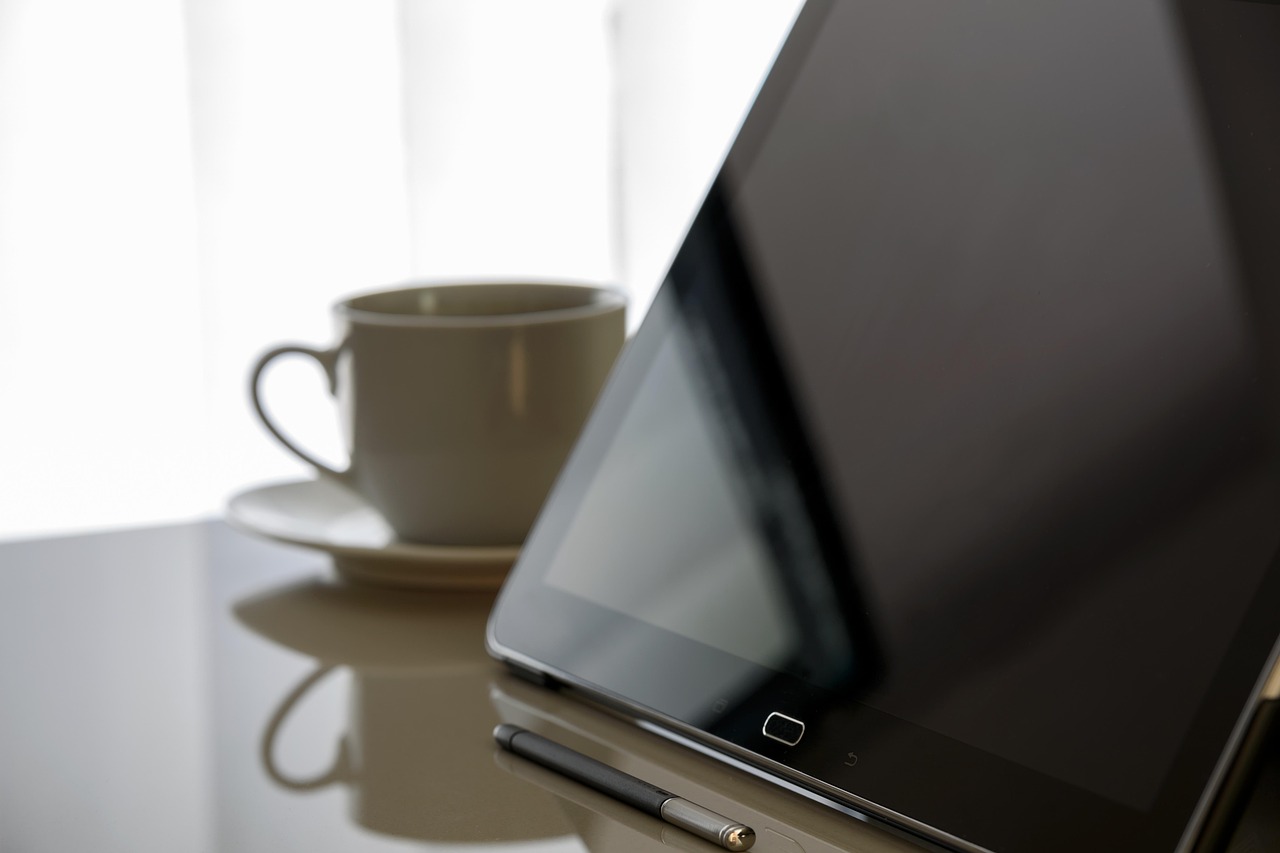 A tablet showing clean financial growth charts and data metrics.