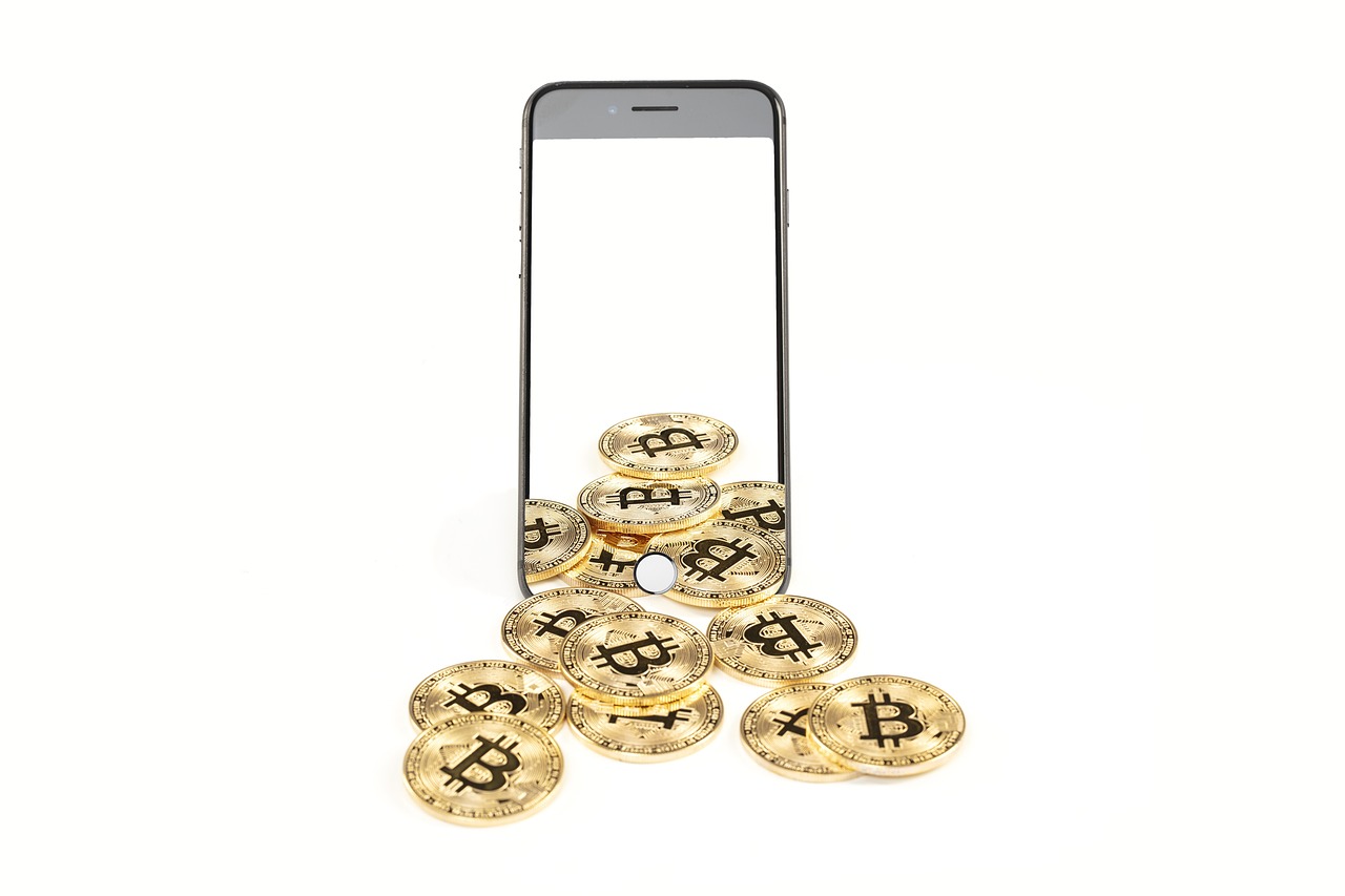 A smartphone resting next to a modern clock symbolizing transaction time.